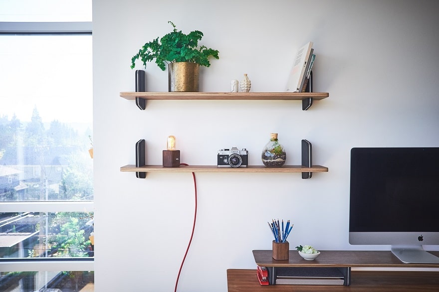 Best Organization Ideas of 2018, a room with an organized brown desk and symmetrical white shelves on the wall